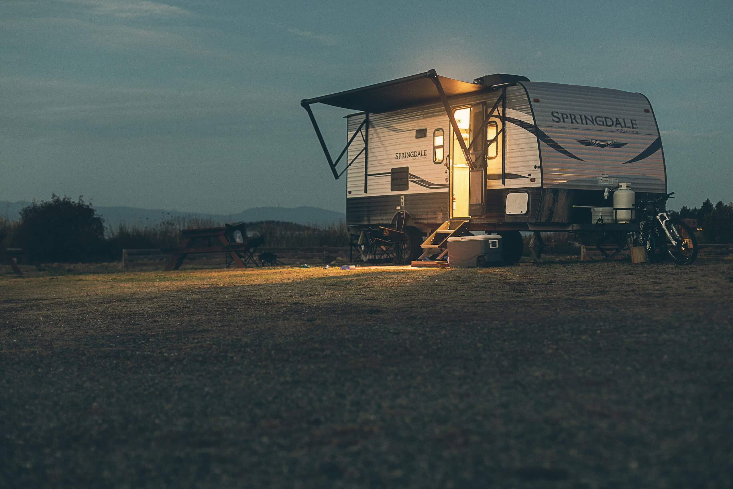 Travel trailer parked outdoors at dusk on Vancouver Island